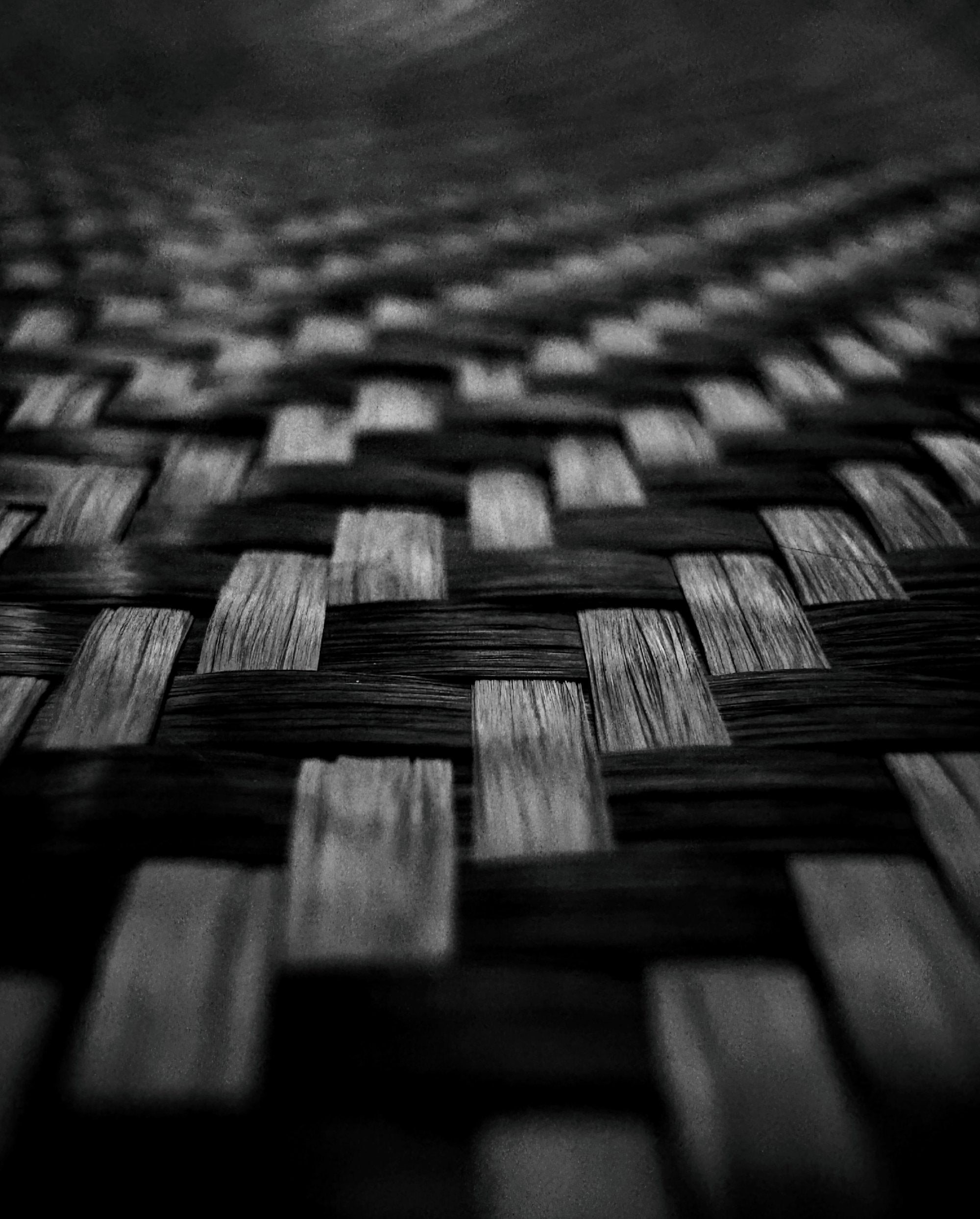 Close-up of real 2x2 twill carbon fiber weave with premium texture and depth